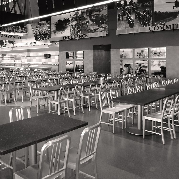 Durable Aluminum Navy Chairs in a Large Dining Hall